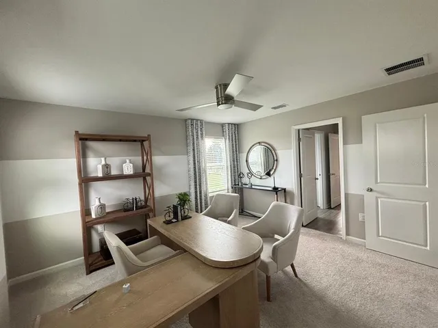 a living room with furniture a window and a fireplace