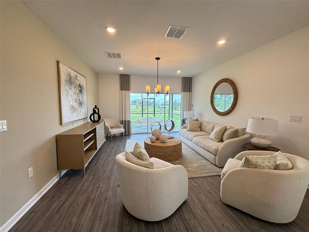 4738 Southwest 83rd Loop Ocala, FL 34476 - Photo 2 of 17 a living room with furniture and a large window