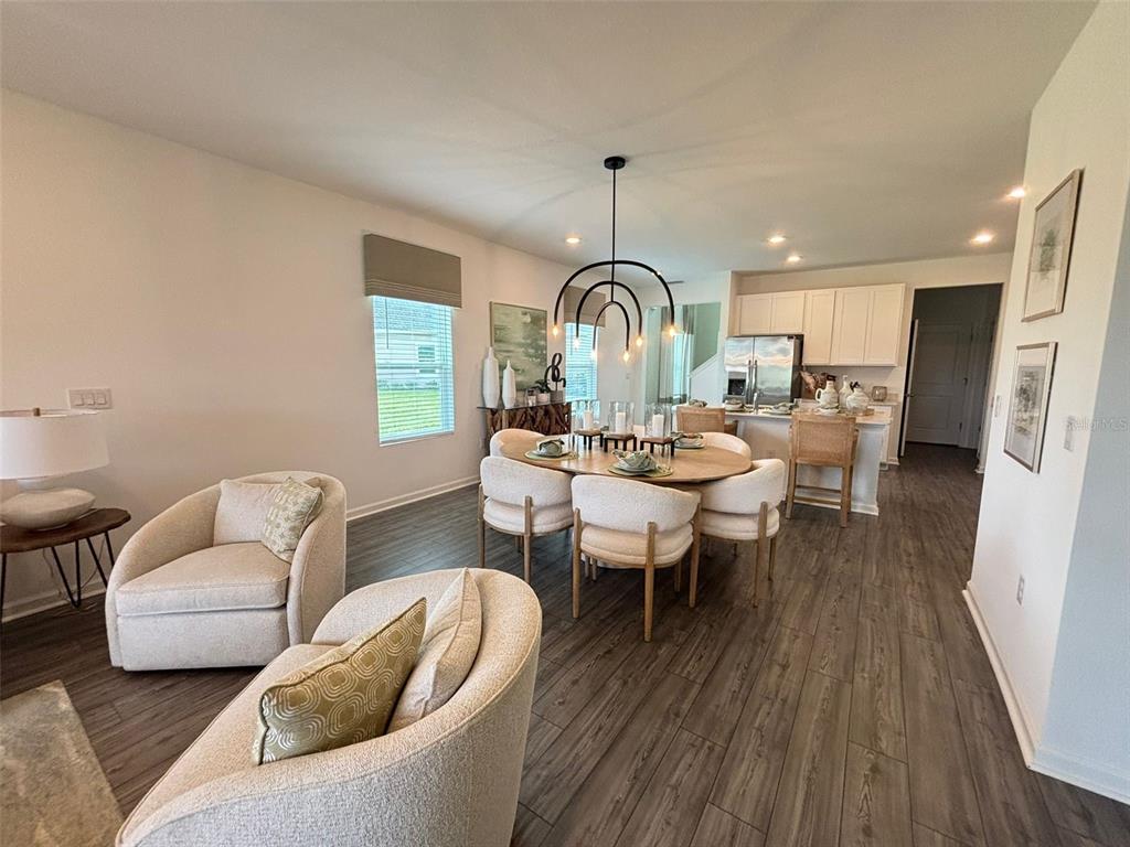 4738 Southwest 83rd Loop Ocala, FL 34476 - Photo 4 of 17 a living room with furniture and a wooden floor