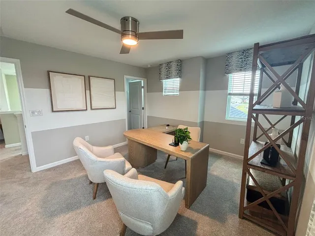 a living room with furniture a air conditioner and a window