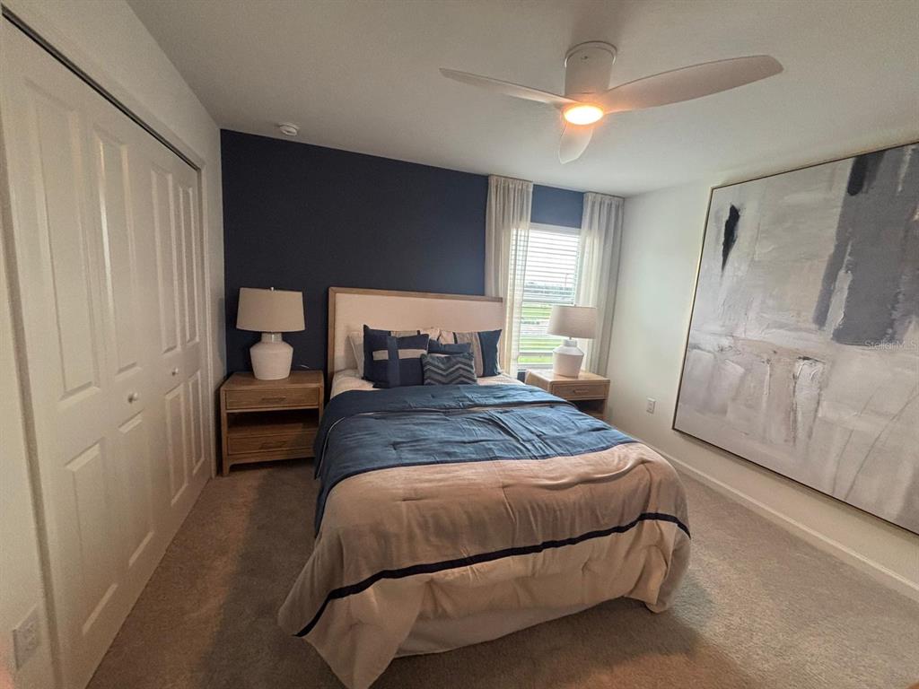 4738 Southwest 83rd Loop Ocala, FL 34476 - Photo 10 of 17 a bedroom with a bed and a mirror