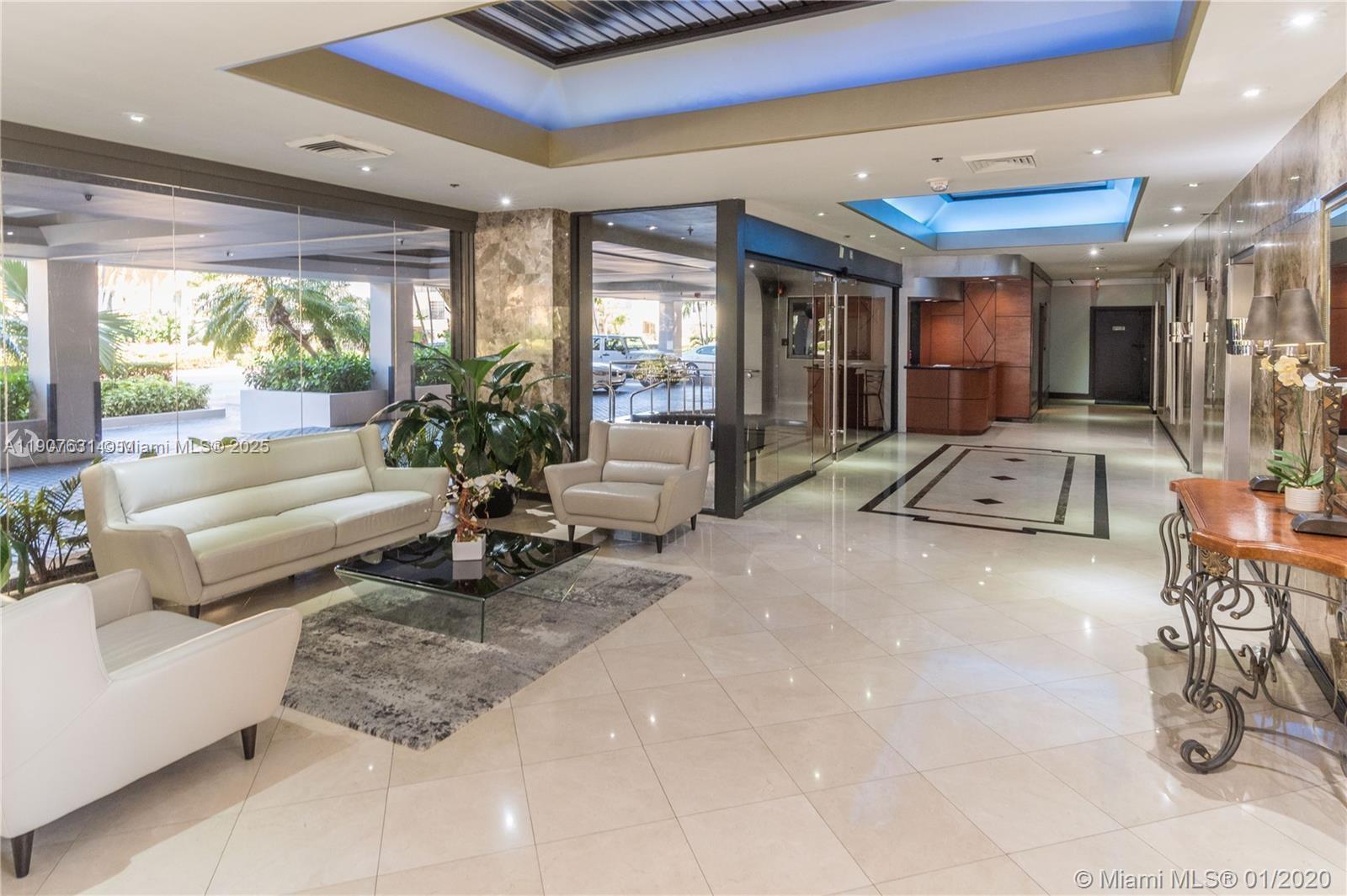 8877 Collins Avenue, Unit 604 Surfside, FL 33154 - Photo 17 of 25 a living room with furniture large windows and large windows
