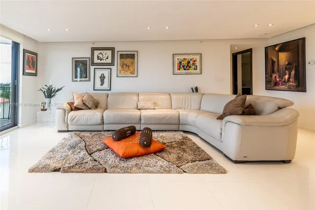 a living room with furniture and a rug