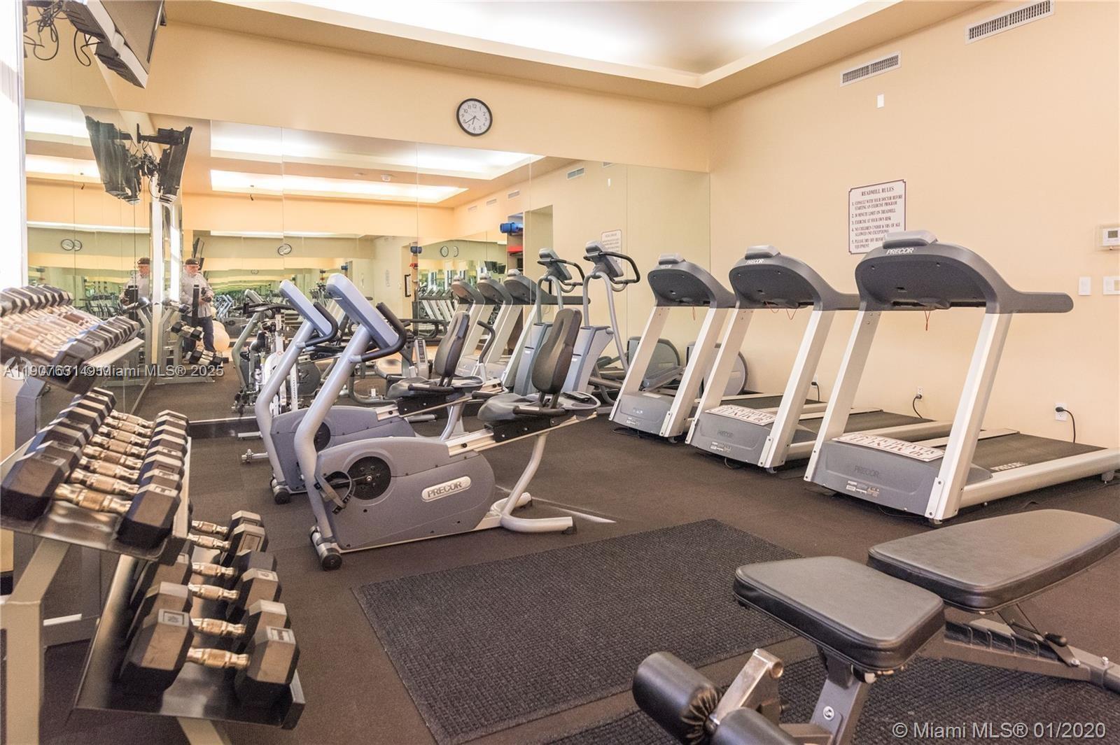 8877 Collins Avenue, Unit 604 Surfside, FL 33154 - Photo 21 of 25 a view of a room with gym equipment