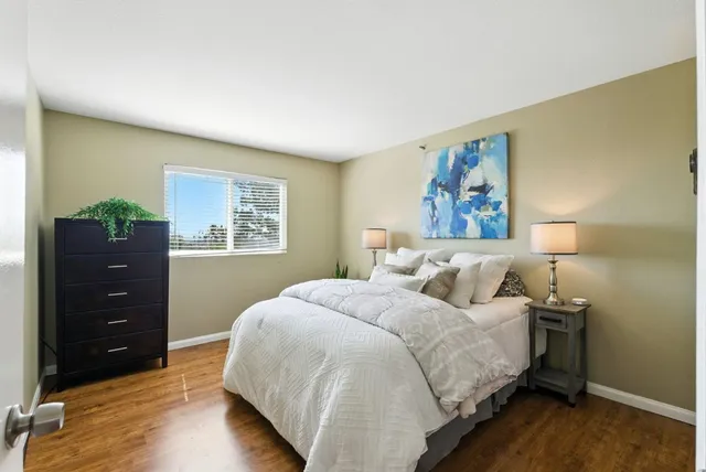 a bedroom with a bed and a dresser