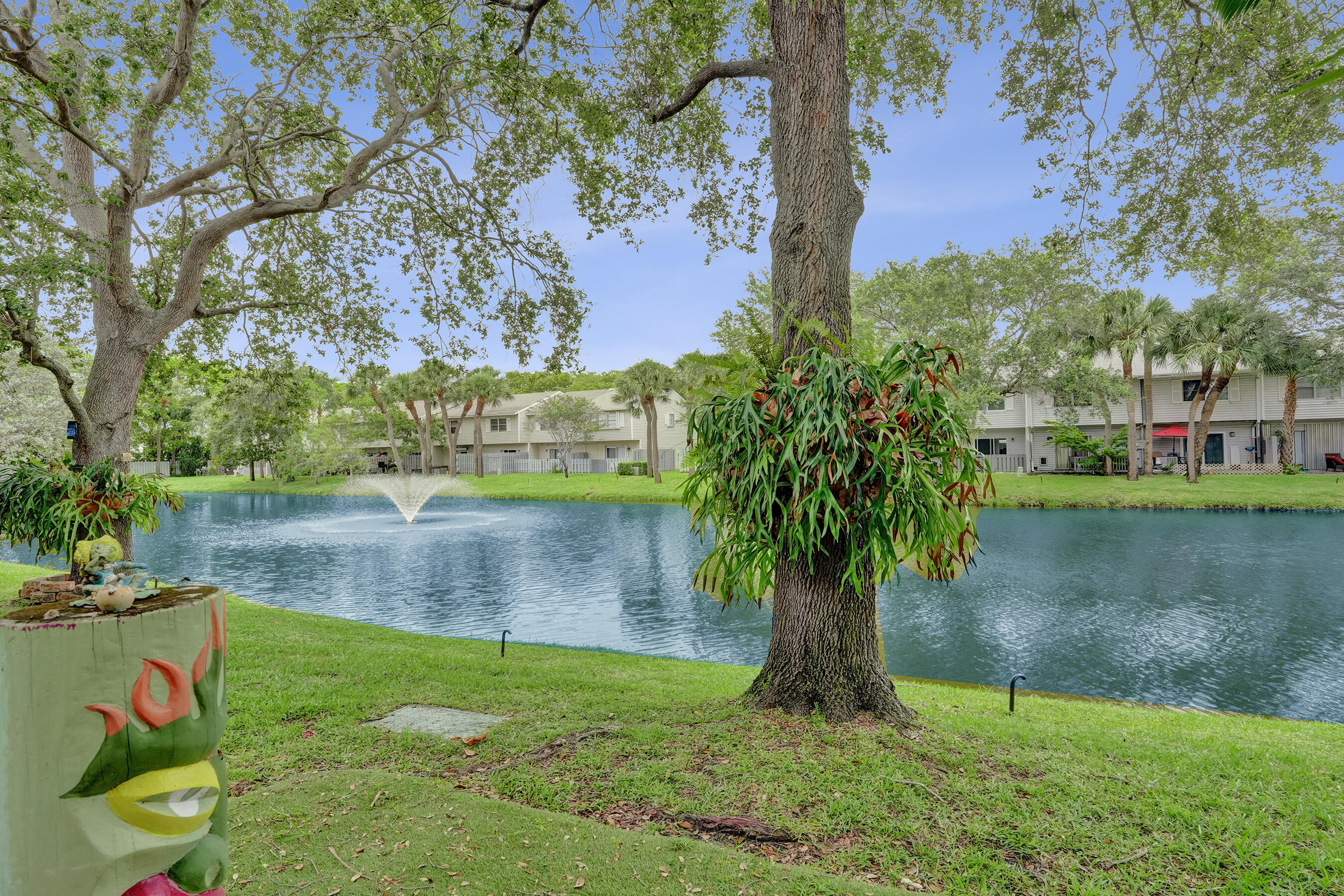 147 Southwest 3rd Street Pompano Beach, FL 33060 - Photo 15 of 29 a view of a garden with a lake