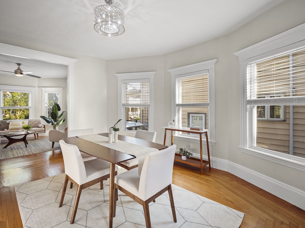 30 Baker Road Everett, MA 02149 - Photo 11 of 42 a dining room with wooden floor and a window