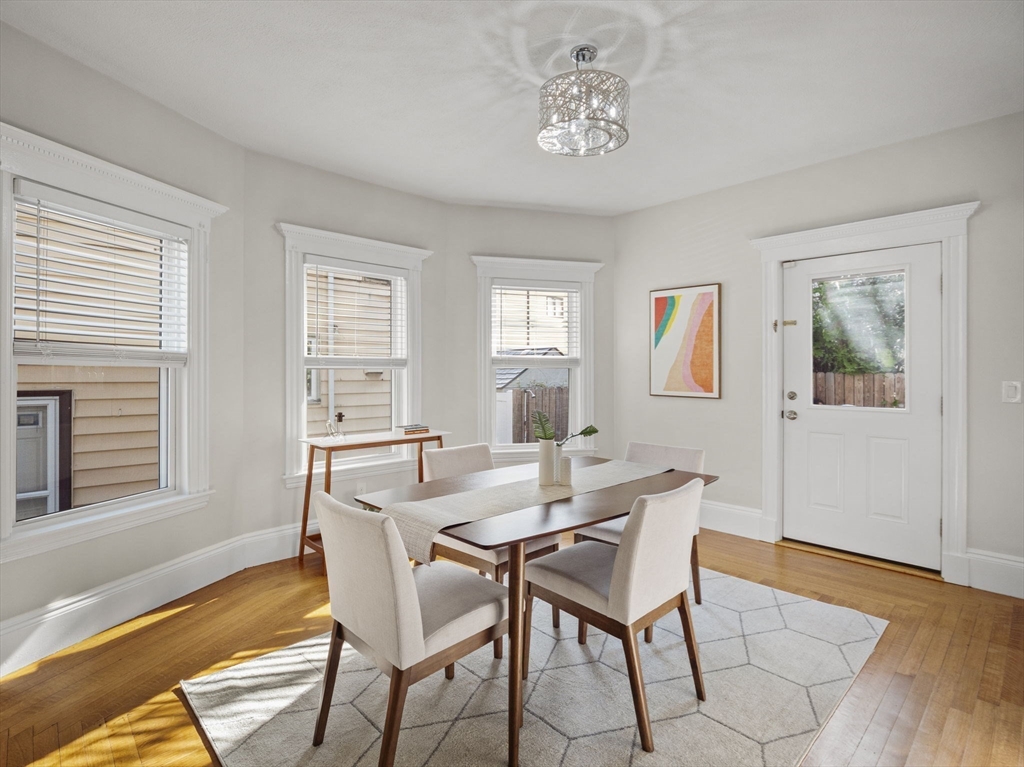 30 Baker Road Everett, MA 02149 - Photo 12 of 42 a view of a dining room with furniture window and wooden floor