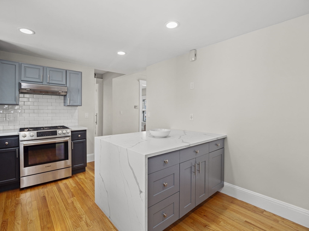 30 Baker Road Everett, MA 02149 - Photo 18 of 42 a kitchen with a sink and a stove top oven