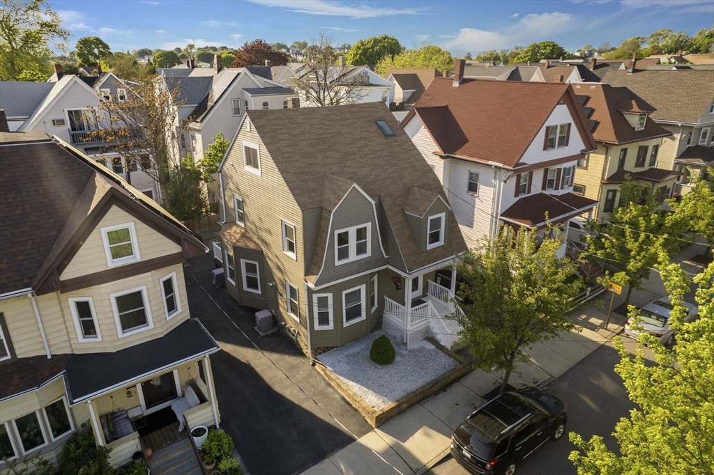 30 Baker Road Everett, MA 02149 - Photo 2 of 42 an aerial view of a house with a yard