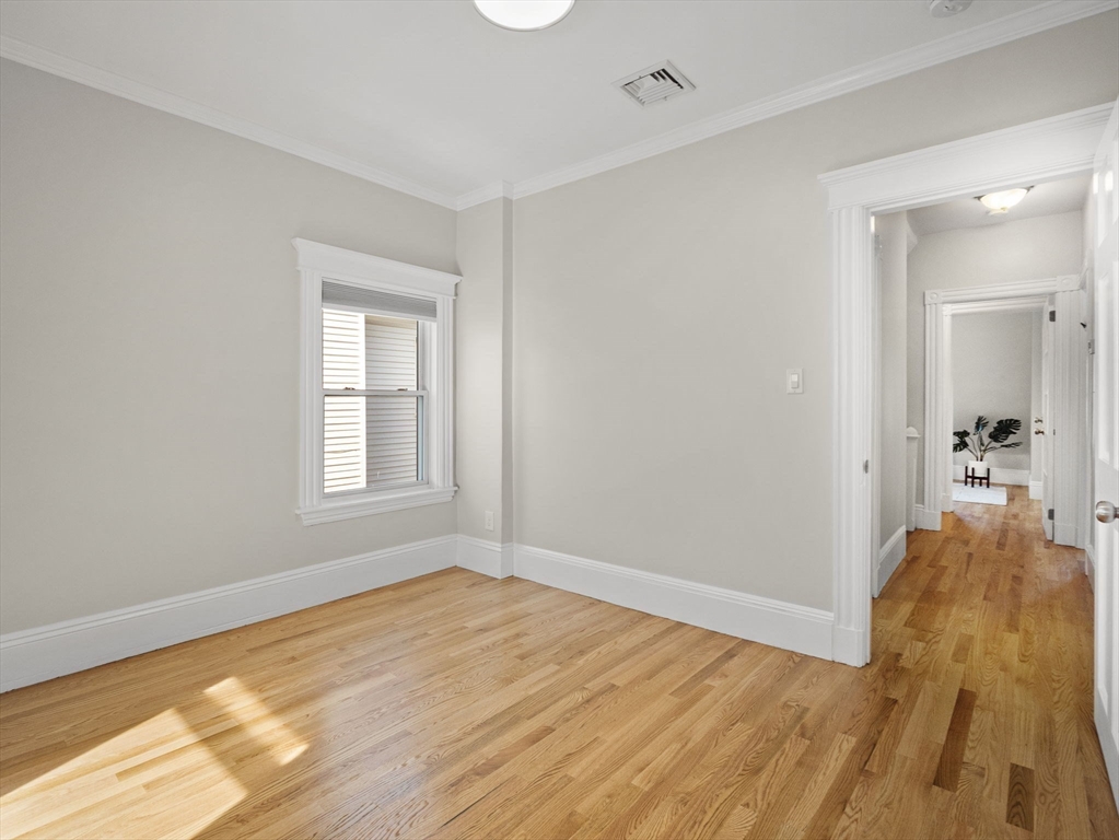 30 Baker Road Everett, MA 02149 - Photo 27 of 42 a view of a livingroom with wooden floor and a bathroom