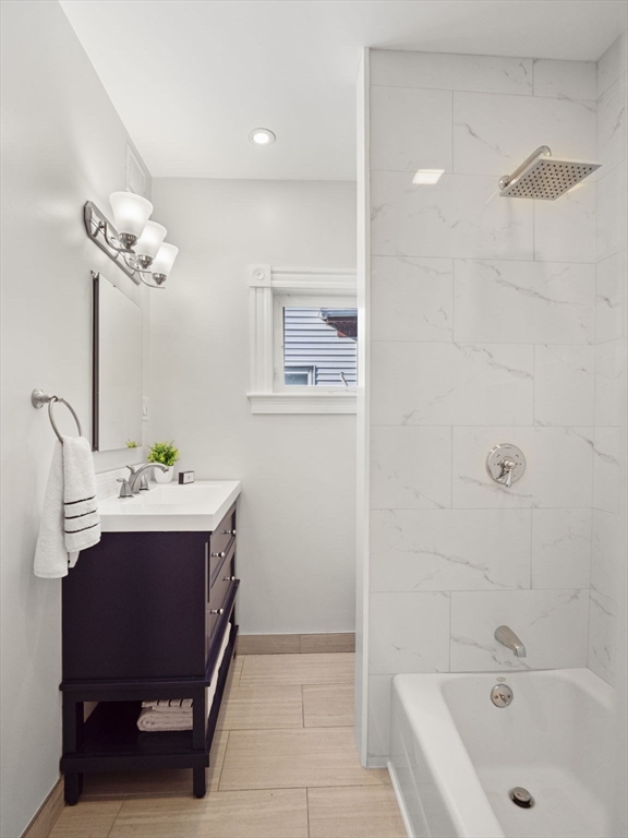30 Baker Road Everett, MA 02149 - Photo 28 of 42 a bathroom with a sink and a bathtub