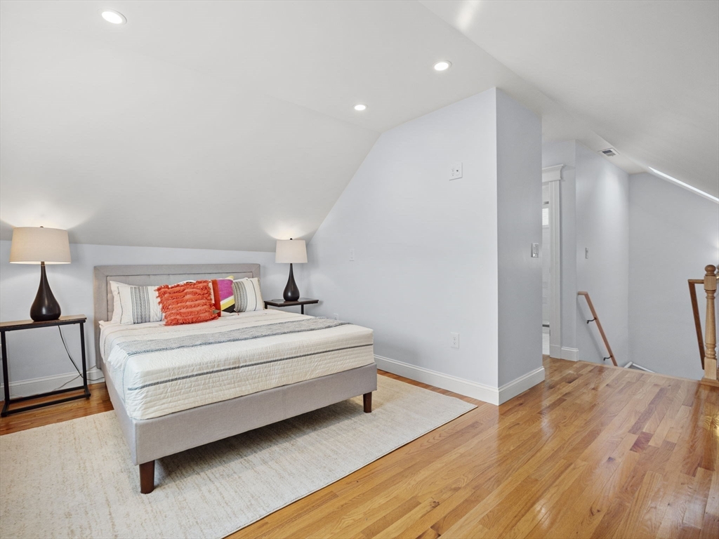 30 Baker Road Everett, MA 02149 - Photo 33 of 42 a utility room with wooden floor and furniture