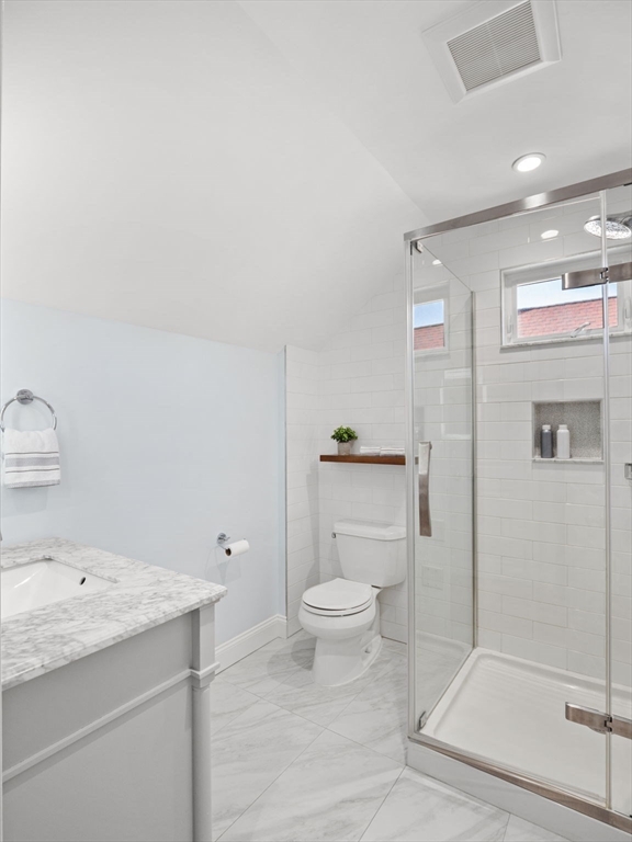 30 Baker Road Everett, MA 02149 - Photo 35 of 42 a bathroom with a granite countertop sink a toilet and shower