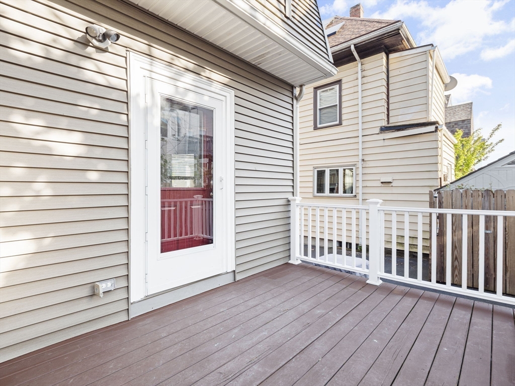 30 Baker Road Everett, MA 02149 - Photo 36 of 42 a view of a house with wooden deck