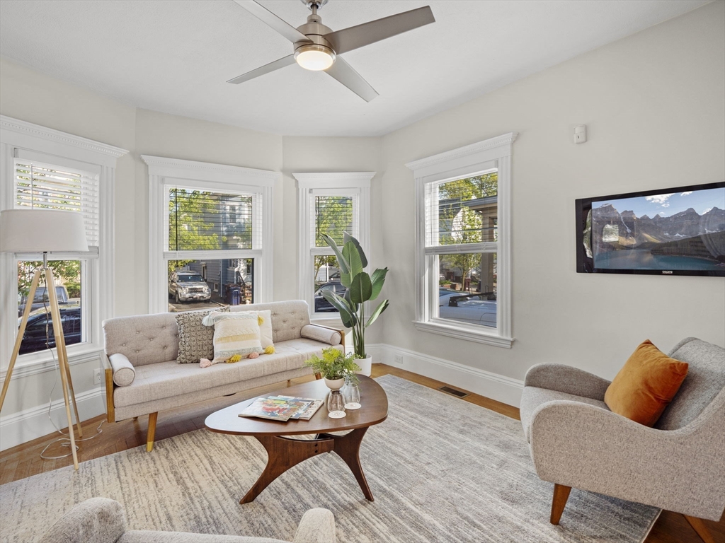30 Baker Road Everett, MA 02149 - Photo 9 of 42 a living room with furniture a rug and a window