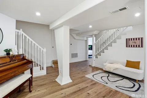 a livingroom with furniture and wooden floor