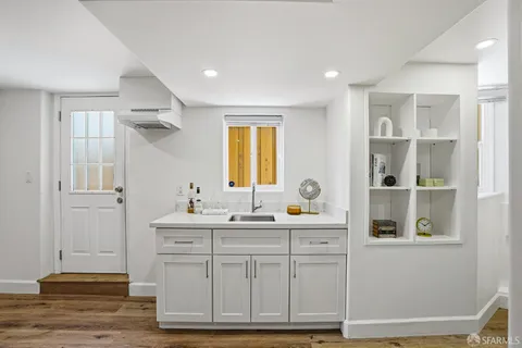 a bathroom with a sink a vanity and a mirror