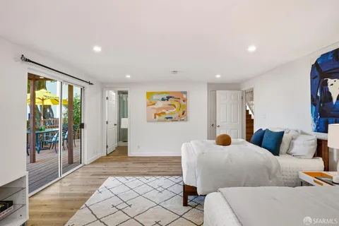 a living room with furniture and large window