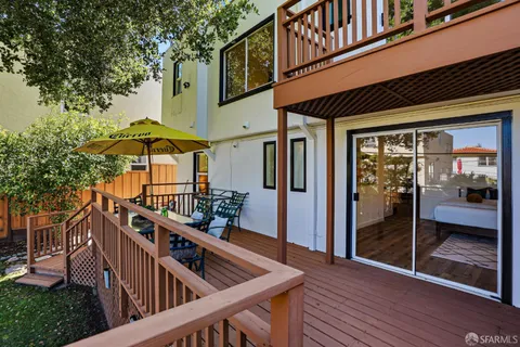 a balcony view with a seating space