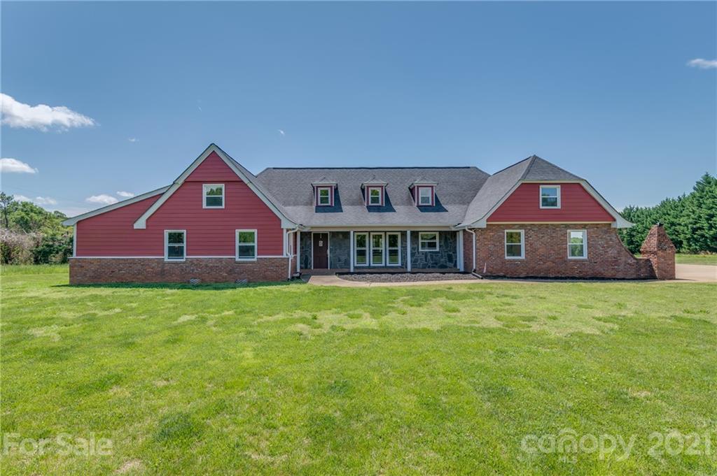 606 Old Stonecutter Road Rutherfordton, NC 28139 - Photo 1 of 48 a front view of a house with a yard