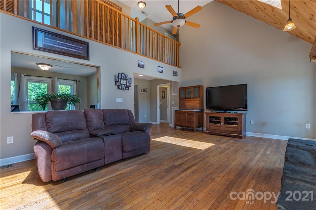 606 Old Stonecutter Road Rutherfordton, NC 28139 - Photo 14 of 48 a living room with furniture and a flat screen tv