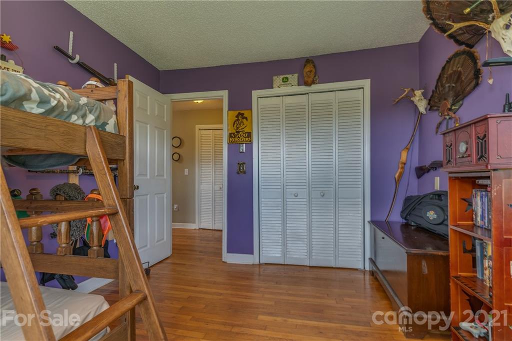606 Old Stonecutter Road Rutherfordton, NC 28139 - Photo 23 of 48 a view of a room that has a lot of stuff and hardwood floor