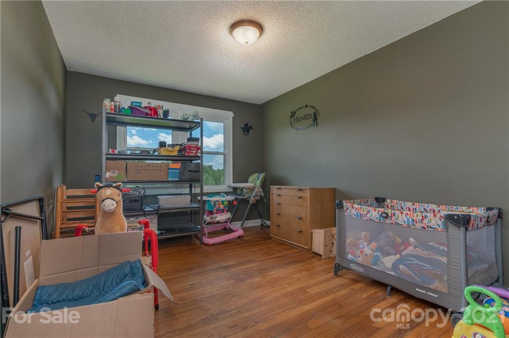 606 Old Stonecutter Road Rutherfordton, NC 28139 - Photo 24 of 48 a room with furniture and toys