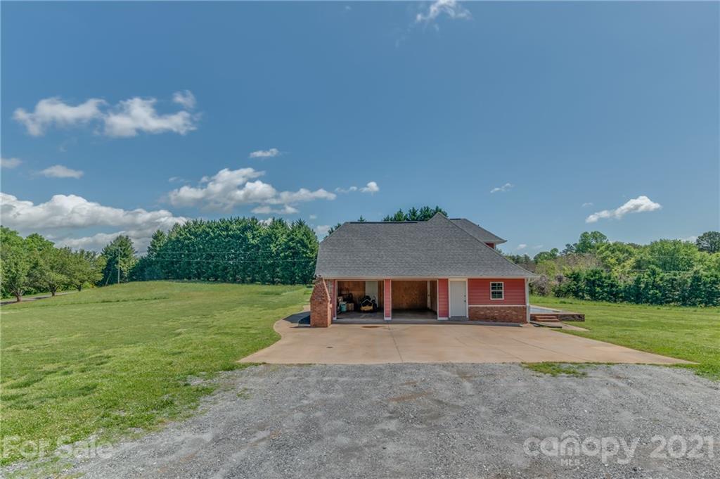 606 Old Stonecutter Road Rutherfordton, NC 28139 - Photo 38 of 48 a front view of a house with garden