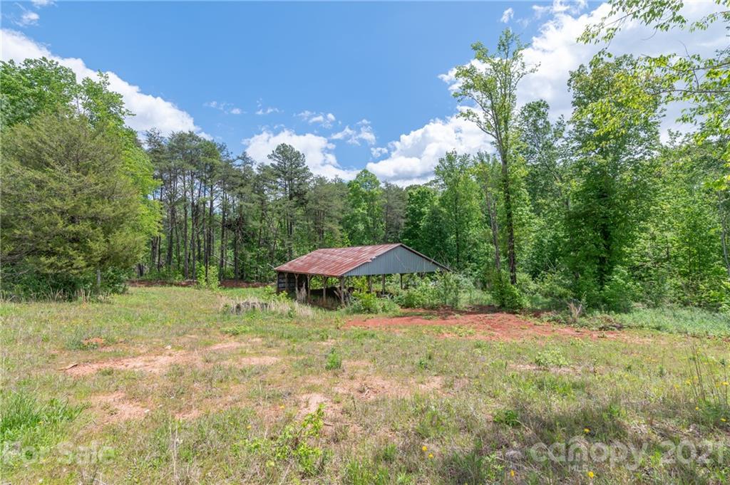606 Old Stonecutter Road Rutherfordton, NC 28139 - Photo 44 of 48 a backyard of a house with table and chairs