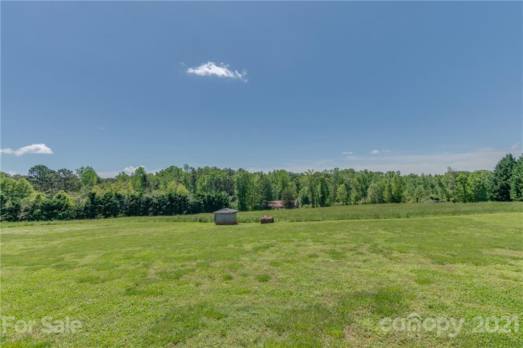 606 Old Stonecutter Road Rutherfordton, NC 28139 - Photo 47 of 48 a view of a green field with trees in the background