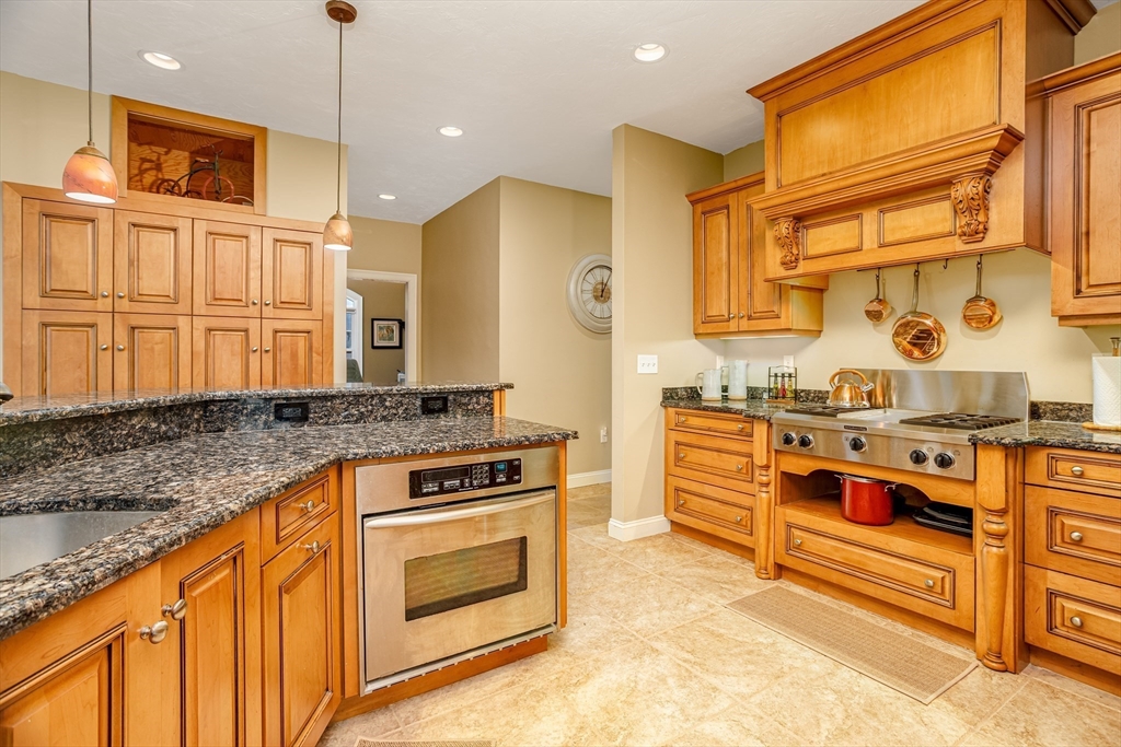 837 Mt Elam Road Fitchburg, MA 01420 - Photo 15 of 42 a kitchen with stainless steel appliances granite countertop a stove a sink and a refrigerator