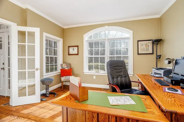 a living room filled with furniture and a window