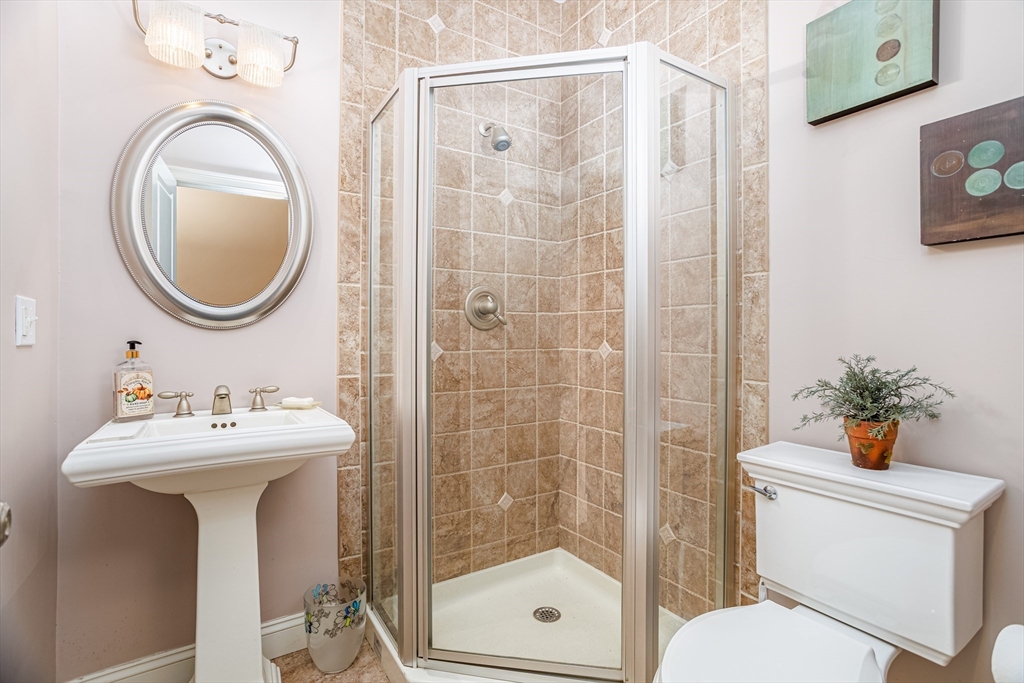 837 Mt Elam Road Fitchburg, MA 01420 - Photo 22 of 42 a bathroom with a sink a mirror a toilet and a shower