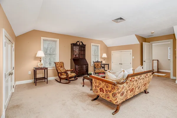 a living room with furniture and a table