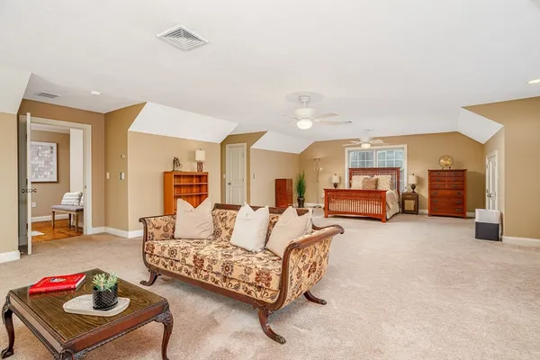 a living room with furniture and a table