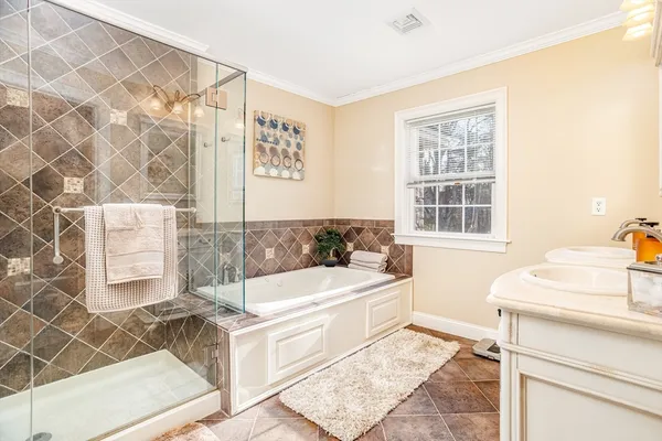 a living room with a couch and a dresser next to a window