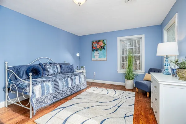 a bedroom with furniture and a window