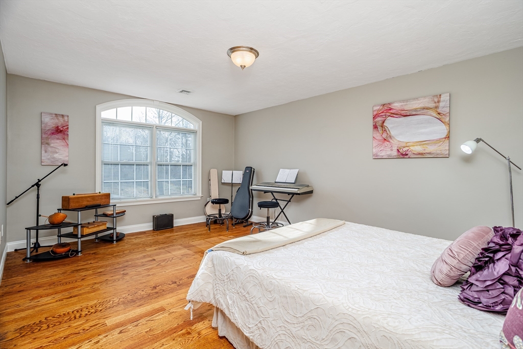 837 Mt Elam Road Fitchburg, MA 01420 - Photo 32 of 42 a bedroom with a bed and a large window