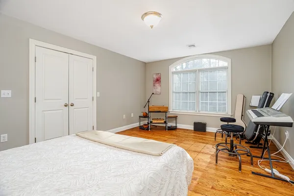 a bedroom with a bed and a table in it