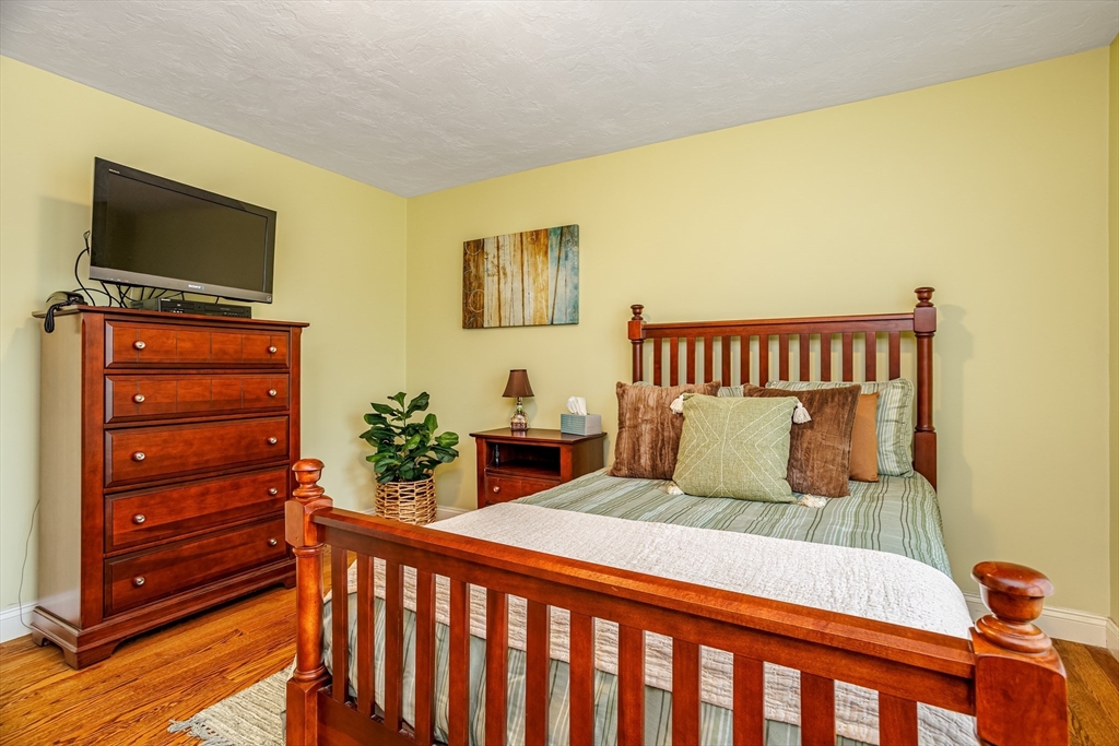 837 Mt Elam Road Fitchburg, MA 01420 - Photo 36 of 42 a bedroom with a bed and a flat screen tv