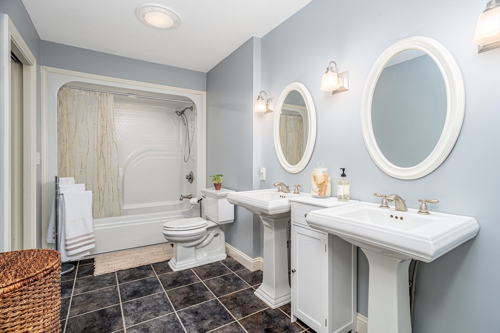 837 Mt Elam Road Fitchburg, MA 01420 - Photo 37 of 42 a bathroom with a double vanity sink mirror and toilet