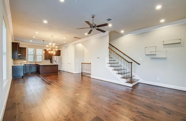 a view of kitchen and hall with wooden floor