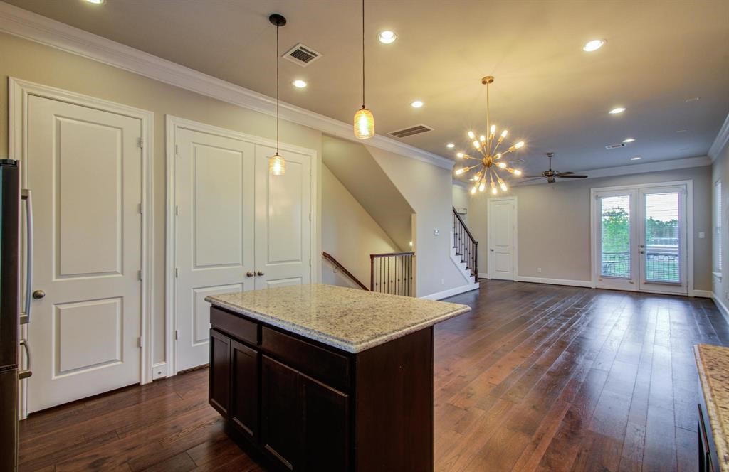 610 Delano Street Houston, TX 77003 - Photo 13 of 36 a room with pool table and chandelier