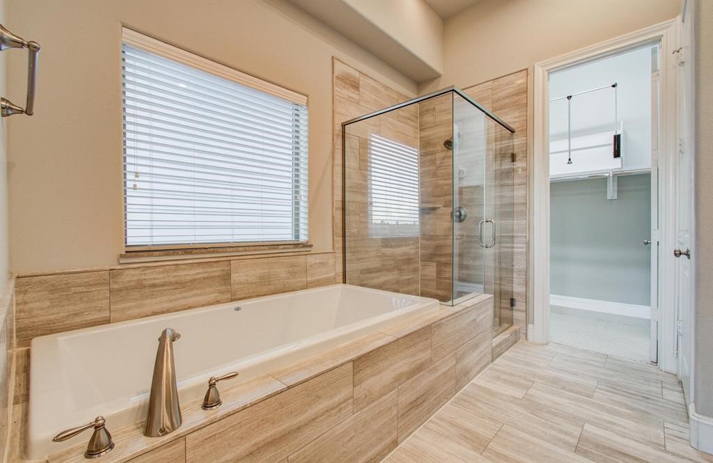 610 Delano Street Houston, TX 77003 - Photo 25 of 36 a bathroom with a bathtub and a shower
