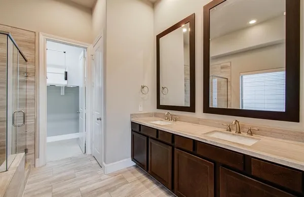 a bathroom with a granite countertop sink mirror and double