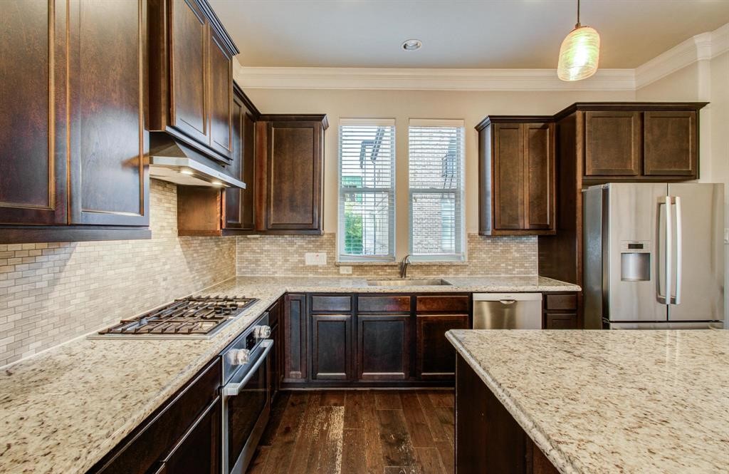 610 Delano Street Houston, TX 77003 - Photo 8 of 36 a kitchen with stainless steel appliances granite countertop a sink stove and refrigerator