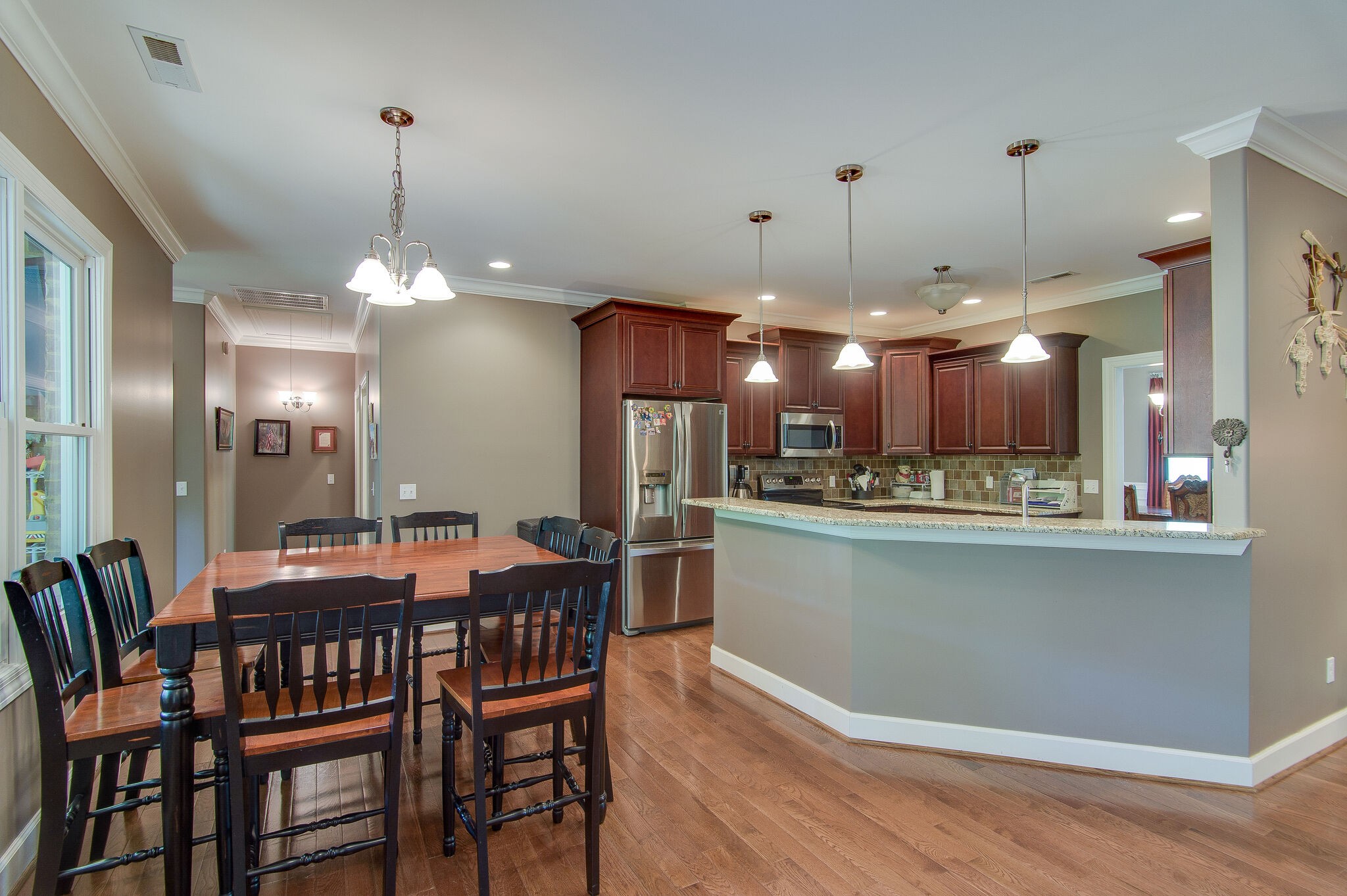 5125 Old Harding Road Franklin, TN 37064 - Photo 13 of 50 a dining room filled with furniture a chandelier and kitchen view