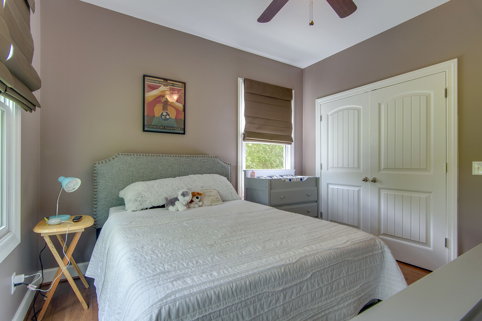 5125 Old Harding Road Franklin, TN 37064 - Photo 20 of 50 a bedroom with a bed and a chandelier