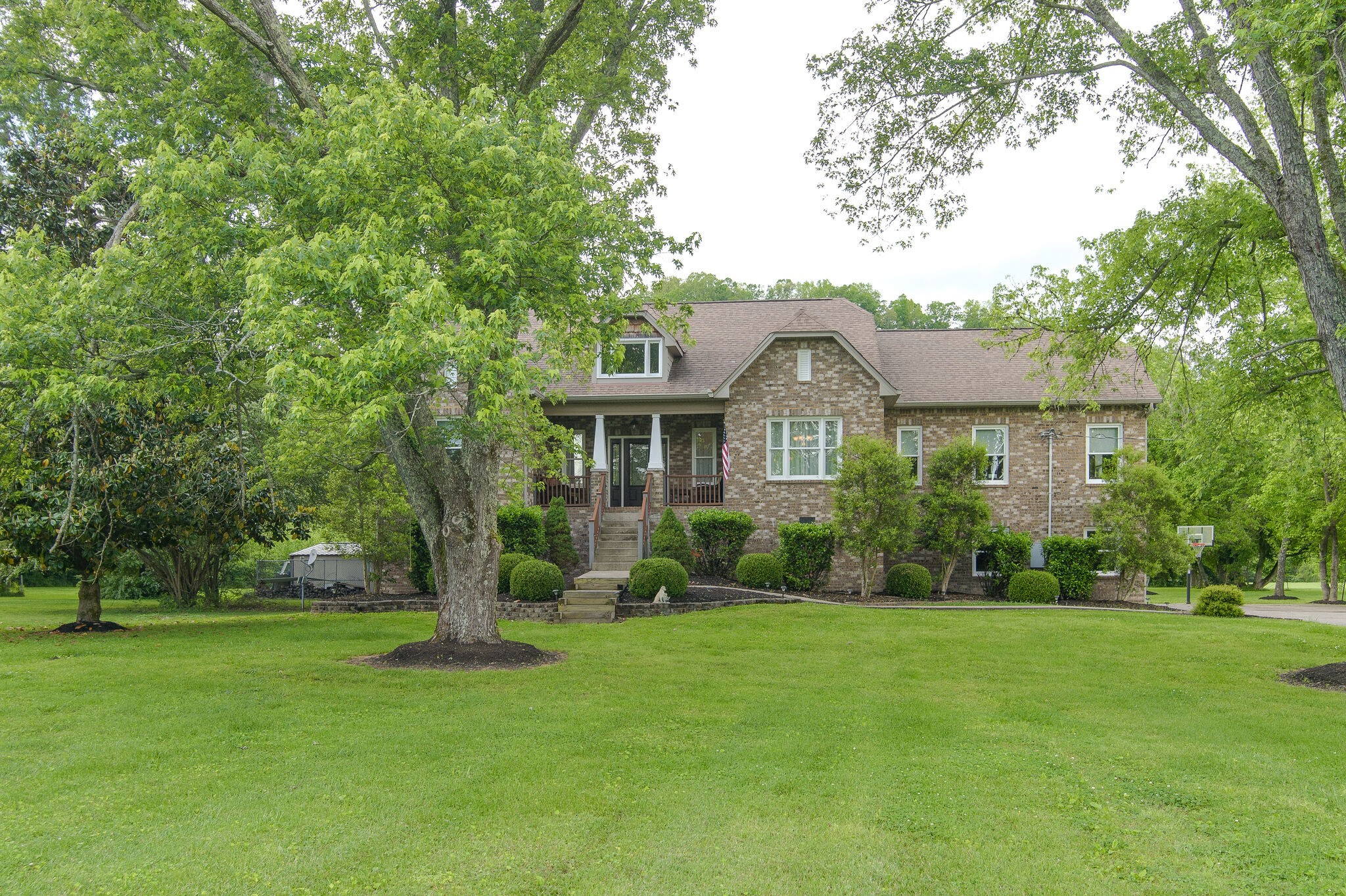 5125 Old Harding Road Franklin, TN 37064 - Photo 2 of 50 a front view of house with yard and green space